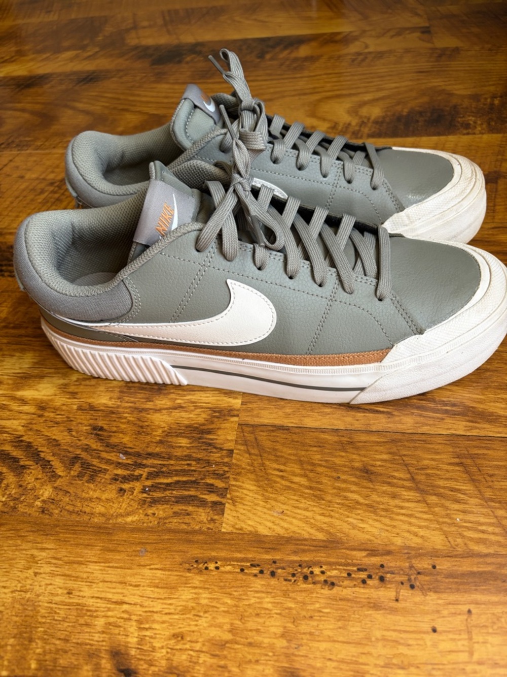 Nike Women’s low top olive green sneakers